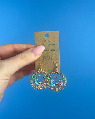 Shop the Holy Family Earrings at All About You Boutique! Gold-tone Nativity Christmas earrings featuring Mary, Joseph, baby Jesus, and sparkling rhinestones.