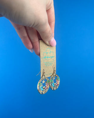 Shop the Holy Family Earrings at All About You Boutique! Gold-tone Nativity Christmas earrings featuring Mary, Joseph, baby Jesus, and sparkling rhinestones.