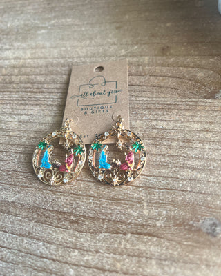 Shop the Holy Family Earrings at All About You Boutique! Gold-tone Nativity Christmas earrings featuring Mary, Joseph, baby Jesus, and sparkling rhinestones.