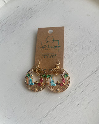 Shop the Holy Family Earrings at All About You Boutique! Gold-tone Nativity Christmas earrings featuring Mary, Joseph, baby Jesus, and sparkling rhinestones.