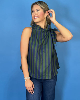 Navy and green striped sleeveless top with a ruffle neckline, statement shoulder tie, and relaxed silhouette.