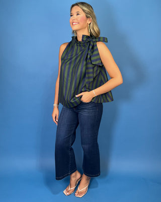 Navy and green striped sleeveless top with a ruffle neckline, statement shoulder tie, and relaxed silhouette.