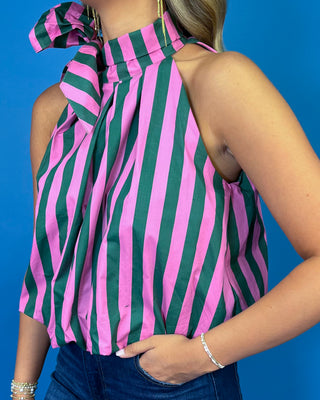Pink and green striped sleeveless top with a high neckline, statement shoulder bow, and relaxed fit.