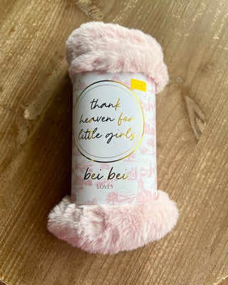 Shop the Bei Bei Faux Fur Lovey in blue, pink, yellow, and ivory. Soft, fluffy baby loveys with sweet messages, perfect for baby showers and newborn gifts.