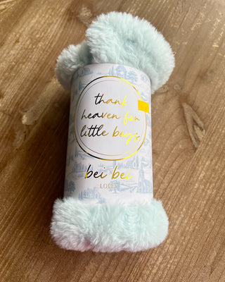 Shop the Bei Bei Faux Fur Lovey in blue, pink, yellow, and ivory. Soft, fluffy baby loveys with sweet messages, perfect for baby showers and newborn gifts.