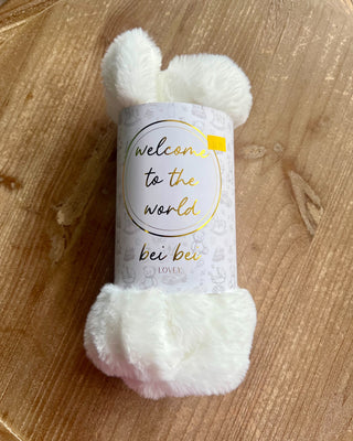Shop the Bei Bei Faux Fur Lovey in blue, pink, yellow, and ivory. Soft, fluffy baby loveys with sweet messages, perfect for baby showers and newborn gifts.
