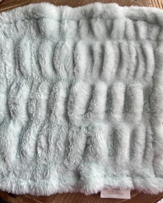 Shop the Bei Bei Faux Fur Lovey in blue, pink, yellow, and ivory. Soft, fluffy baby loveys with sweet messages, perfect for baby showers and newborn gifts.
