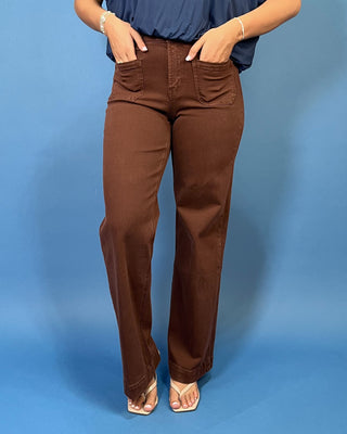Chocolate brown high-rise wide leg jeans with front patch pockets, a flattering structured fit, and full-length silhouette.