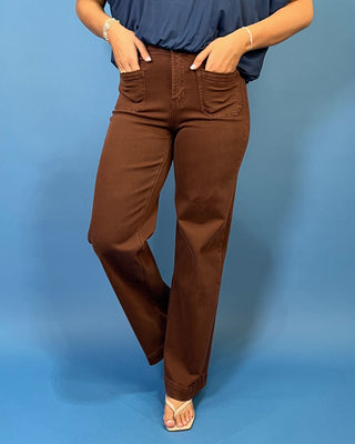 Chocolate brown high-rise wide leg jeans with front patch pockets, a flattering structured fit, and full-length silhouette.