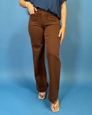 Chocolate brown high-rise wide leg jeans with front patch pockets, a flattering structured fit, and full-length silhouette.