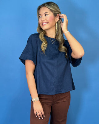 Navy blue short sleeve top with a soft suede-like texture, round neckline, relaxed fit, and easy everyday silhouette.