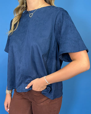Navy blue short sleeve top with a soft suede-like texture, round neckline, relaxed fit, and easy everyday silhouette.