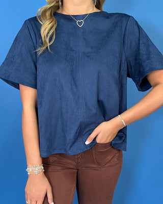 Navy blue short sleeve top with a soft suede-like texture, round neckline, relaxed fit, and easy everyday silhouette.