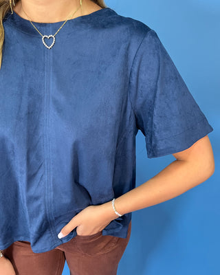 Navy blue short sleeve top with a soft suede-like texture, round neckline, relaxed fit, and easy everyday silhouette.