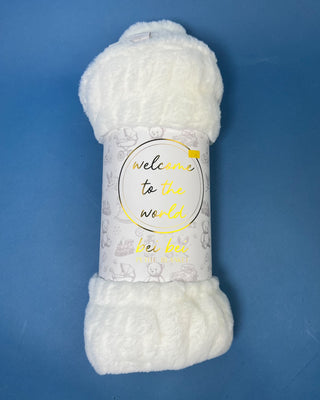 Shop the Bei Bei Faux Fur Petite Blanket in pink, blue, yellow, and white. A soft, fluffy baby blanket perfect for newborn gifts and baby showers.