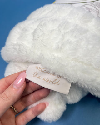 Shop the Bei Bei Faux Fur Petite Blanket in pink, blue, yellow, and white. A soft, fluffy baby blanket perfect for newborn gifts and baby showers.