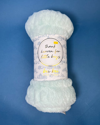 Shop the Bei Bei Faux Fur Petite Blanket in pink, blue, yellow, and white. A soft, fluffy baby blanket perfect for newborn gifts and baby showers.