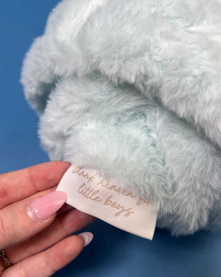 Shop the Bei Bei Faux Fur Petite Blanket in pink, blue, yellow, and white. A soft, fluffy baby blanket perfect for newborn gifts and baby showers.
