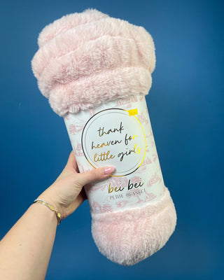 Shop the Bei Bei Faux Fur Petite Blanket in pink, blue, yellow, and white. A soft, fluffy baby blanket perfect for newborn gifts and baby showers.