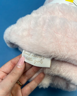 Shop the Bei Bei Faux Fur Petite Blanket in pink, blue, yellow, and white. A soft, fluffy baby blanket perfect for newborn gifts and baby showers.