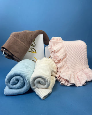 Shop the Flat Knit Baby Blanket in Mocha & Breezy Blue. Features a timeless textured knit design and soft, cozy feel. Perfect for newborn gifts.
