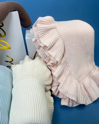 Shop the Ruffle Knit Baby Blanket in Petal Pink & Cloud White. Features soft textured knit and delicate double-layered ruffles. Perfect for baby gifts.