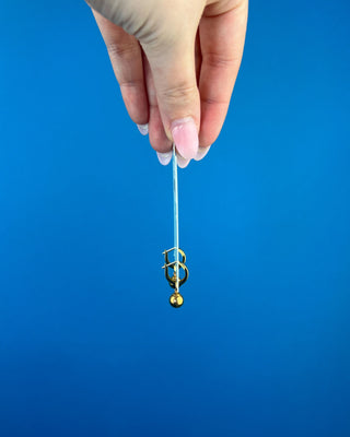 Shop the Enewton Huggie Hoop Gold Charm Earrings featuring polished gold hoops and dangling gold ball charms for timeless everyday style.