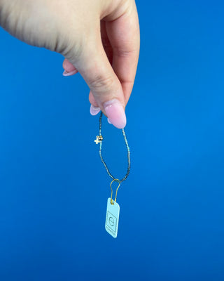 Shop the Enewton Hope Classic Signature Cross Morning Mist Bracelet featuring iridescent gray glass beads and a delicate gold cross charm.