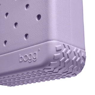 Close-up of a purple sandal sole with 'bogg' branding on a white background
