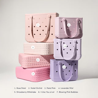 Stack of colorful handbags with color names on a light gray background