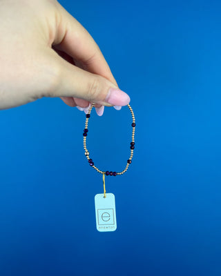 Shop the Enewton Gameday Flirty Hope Unwritten Purple Bracelet featuring polished gold beads and sparkling purple accents. Perfect for game day and everyday!