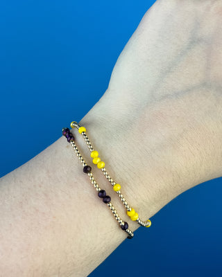 Shop the Enewton Gameday Flirty Hope Unwritten Bracelet featuring gold beads and colorful accents. Available in Black, Golden Yellow, and Red.