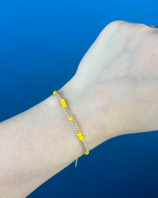 Shop the Enewton Gameday Flirty Hope Unwritten Bracelet featuring gold beads and colorful accents. Available in Black, Golden Yellow, and Red.
