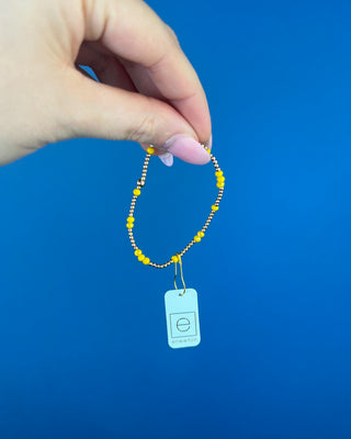 Shop the Enewton Gameday Flirty Hope Unwritten Bracelet featuring gold beads and colorful accents. Available in Black, Golden Yellow, and Red.