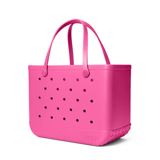 Pink tote bag with black dots on a white background