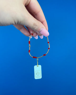 Shop the Enewton Gameday Flirty Hope Unwritten Bracelet featuring gold beads and colorful accents. Available in Black, Golden Yellow, and Red.