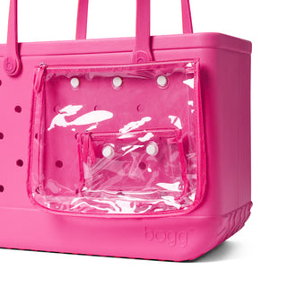 Pink tote bag with clear front section and 'bogg' branding on a white background