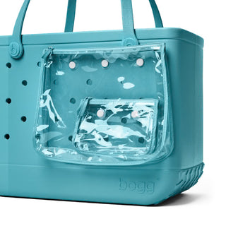 Teal Bogg bag with clear side pocket on a white background