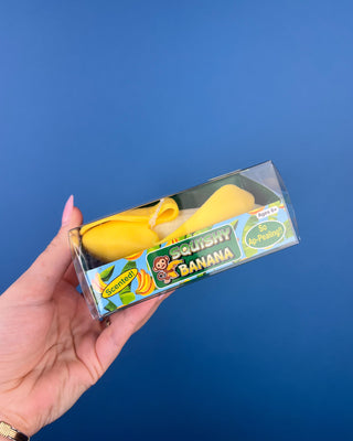 Shop the Squishy Banana! This scented, peelable banana sensory toy features a soft, squeezable texture and makes a fun gift for kids ages 6+.