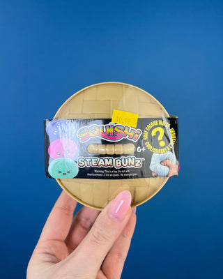 Shop the Squishi Steam Bunz! Discover adorable mystery-color dumpling squishy toys with steamer-inspired packaging and a chance to find a rare color.