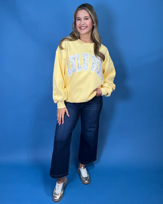 Lulu Mac Buttercream Camo Varsity Crewneck featuring a cozy fleece-lined interior, oversized camouflage varsity applique, relaxed fit, and classic collegiate style