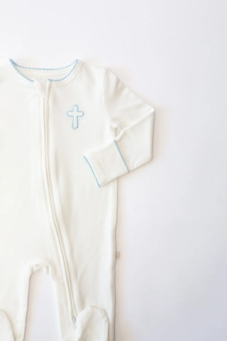 White baby gown with blue cross on a white background