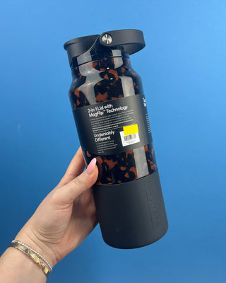 Shop the BrüMate Rise 35oz in Tortoise! This insulated, 100% leakproof water bottle features a 2-in-1 lid, carrying handle, and stylish tortoise finish.