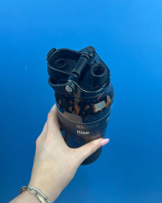 Shop the BrüMate Rise 35oz in Tortoise! This insulated, 100% leakproof water bottle features a 2-in-1 lid, carrying handle, and stylish tortoise finish.