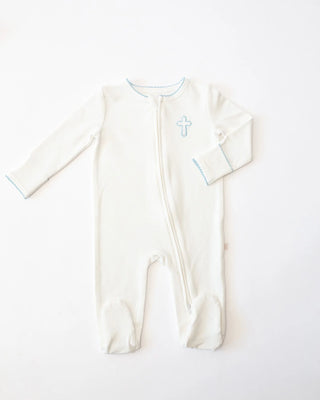 White baby onesie with blue cross design on a white background