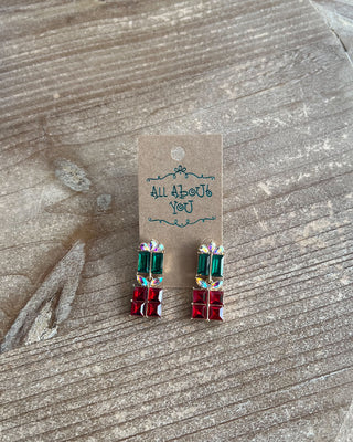 Christmas Present Earrings featuring sparkling red and green rhinestones, iridescent bows, and gold accents.