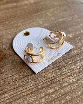 Katy Gold Pearl Earrings featuring elegant double-band hoops, polished gold-tone details, and timeless pearl accents.