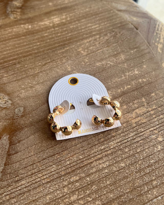 textured gold beads and a bold open-hoop design. Perfect for everyday outfits, date nights, and special occasions.