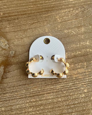 textured gold beads and a bold open-hoop design. Perfect for everyday outfits, date nights, and special occasions.