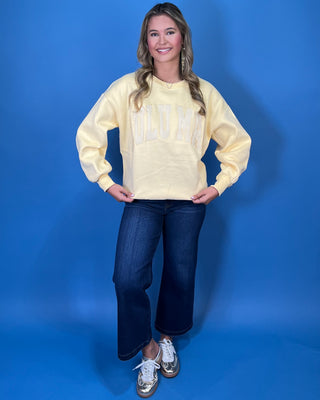 Butter yellow Lulu Mac graphic crewneck sweatshirt with tonal varsity-style lettering, long sleeves, ribbed trim, and a relaxed fit.